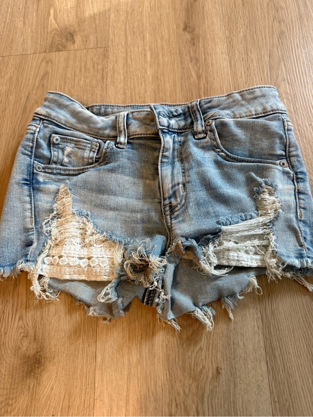 American Eagle Outfitters Light Blue Distressed Denim Shorts with White Lace 4